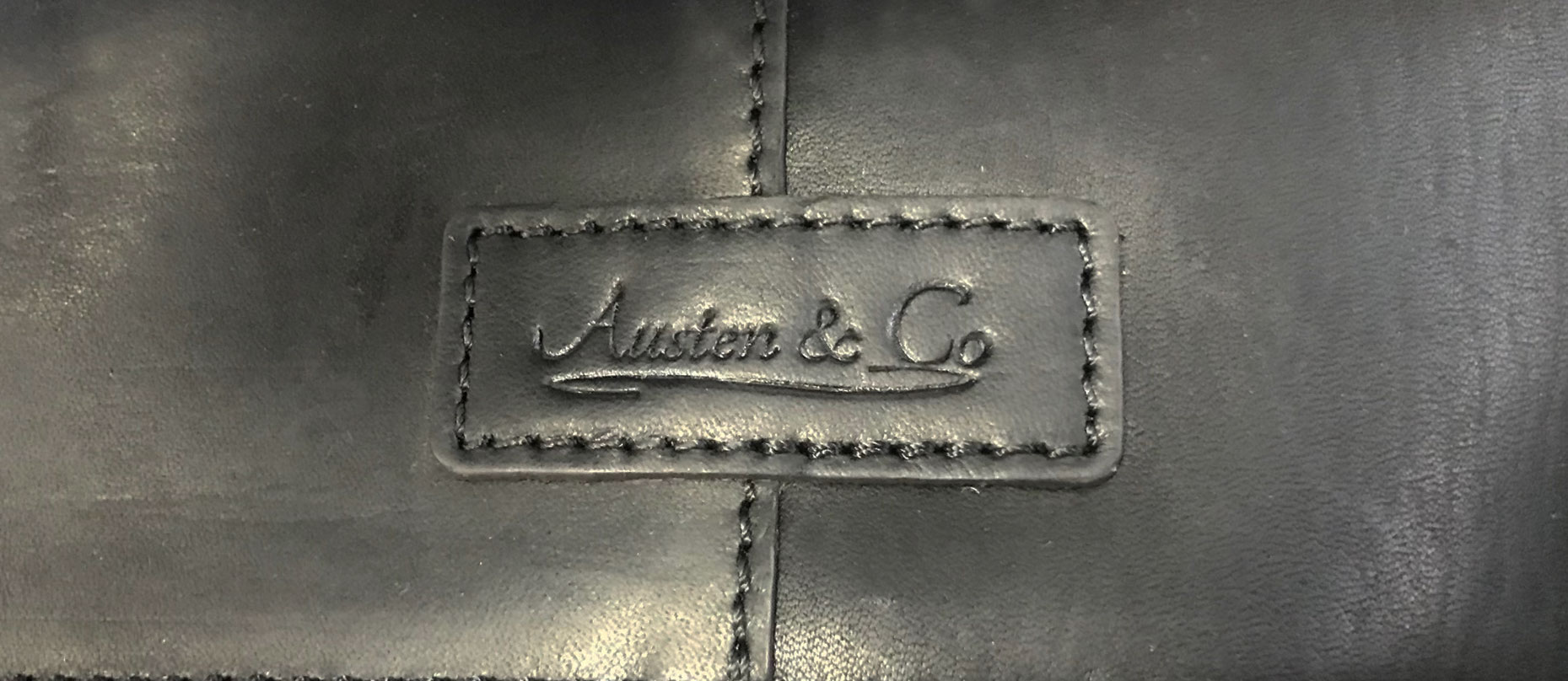 Black Suit Carrier Austen & Co Logo