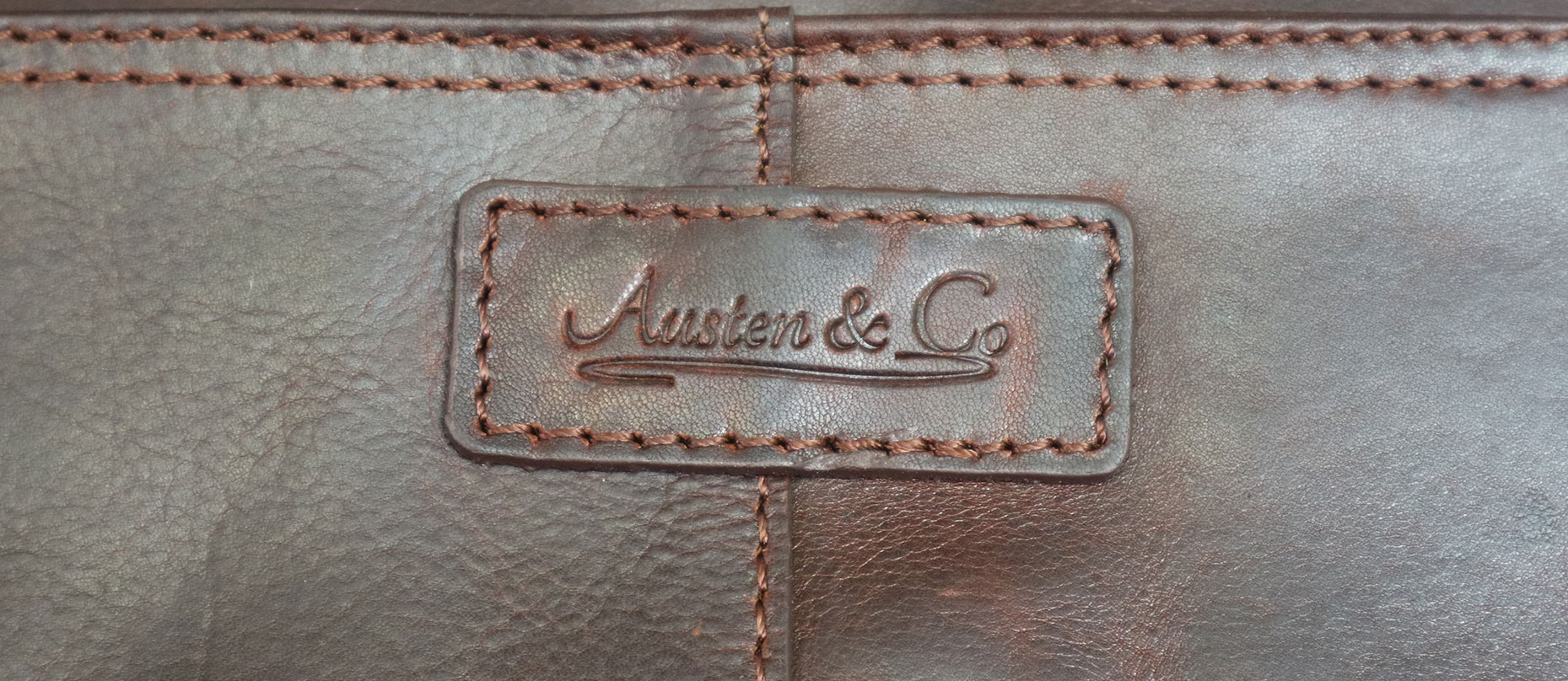 Brown Briefcase Austen & Co Logo